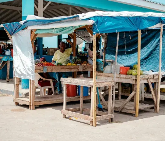 Covered market stall with goods for sale